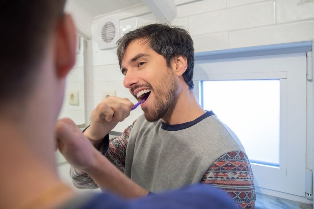 Nighttime oral care routine with brushing and flossing recommended by a dentist in Thornhill