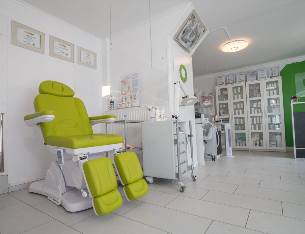Dentist assessing jaw muscles for TMJ treatment at a dental clinic in Thornhill