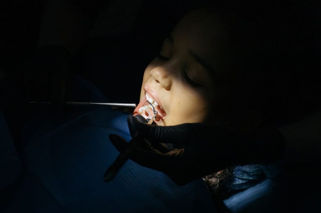 Young girl having a dental checkup before sealants are placed on her molars